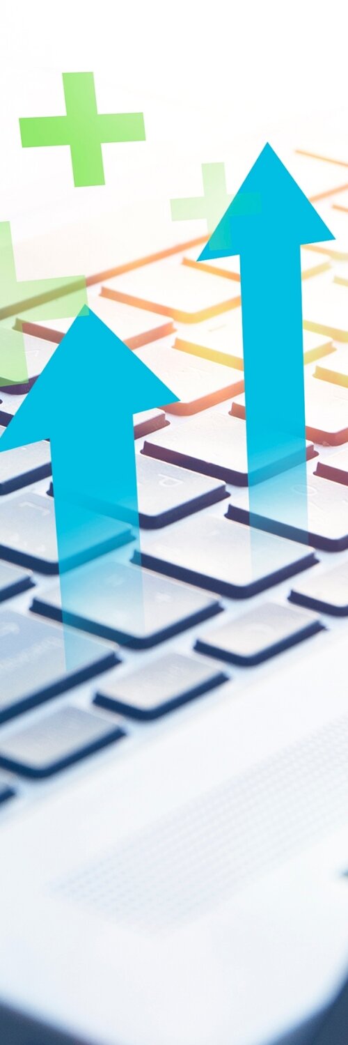 A laptop graphic displays an ecommerce website with icons symbolizing SEO and conversion rate optimization. It represents agency services for improving online store performance.