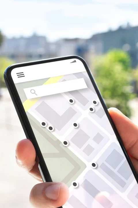User exploring a map on mobile to optimize for local search, enhancing local SEO for better visibility and location-based results