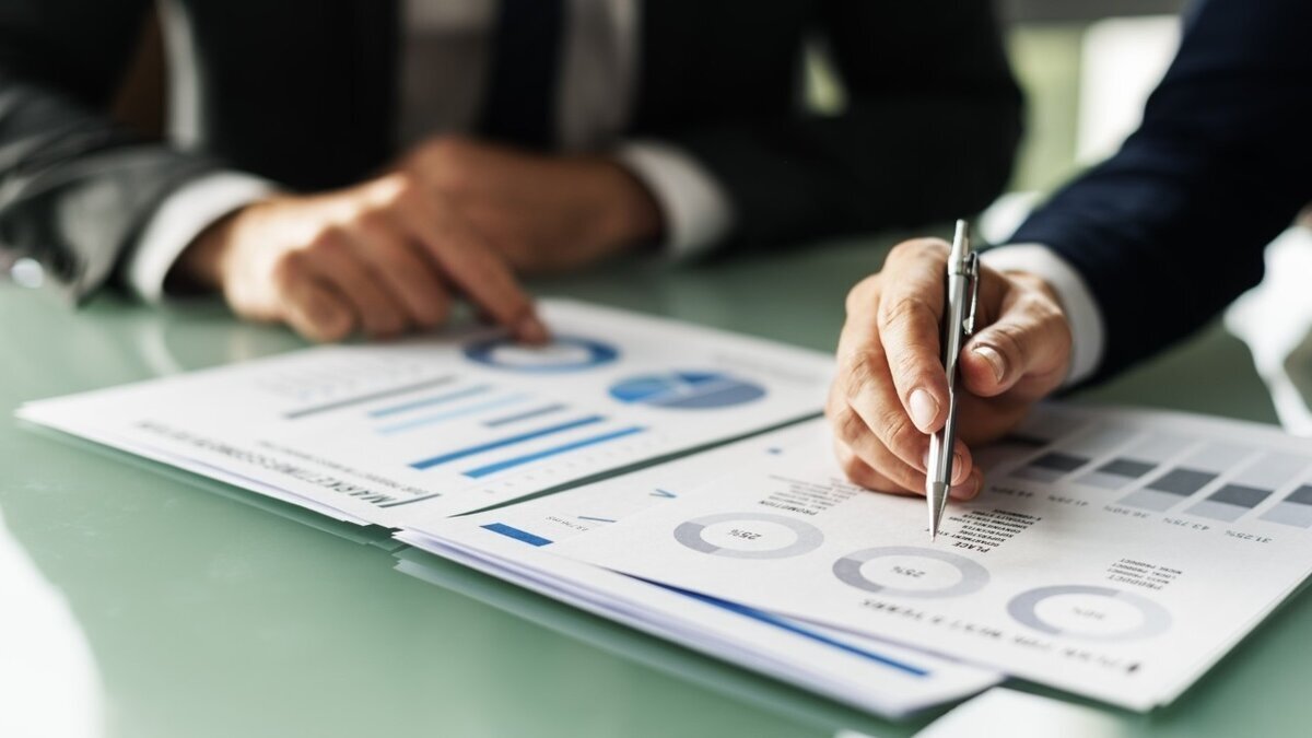 business professionals reviewing data charts and graphs during a meeting, focusing on strategic recommendations for marketing leaders