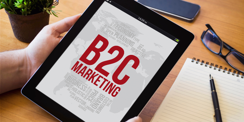A tablet displaying a B2C marketing concept with a focus on consumer engagement and business strategies.