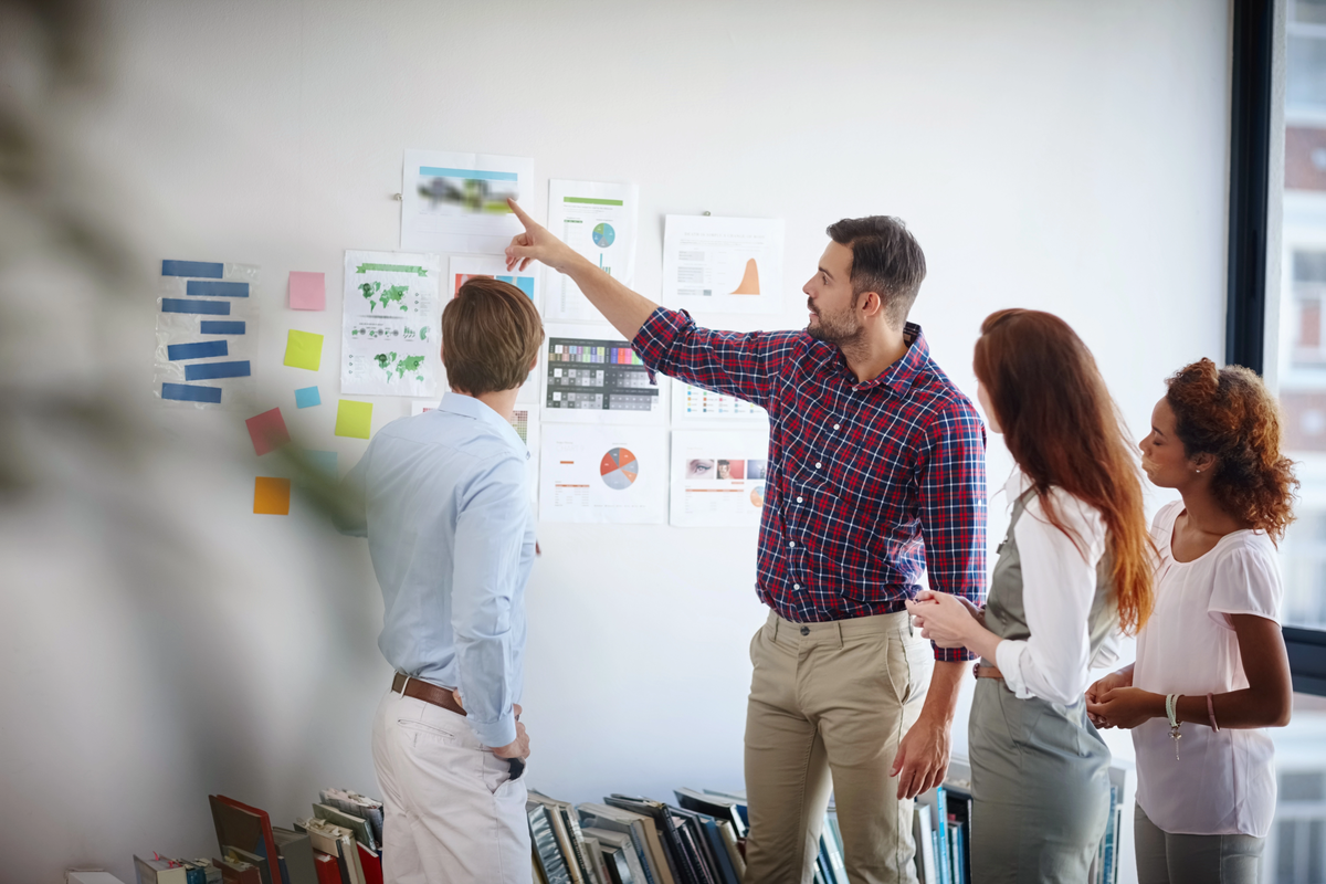 Team of professionals collaborating and discussing an enterprise content management strategy